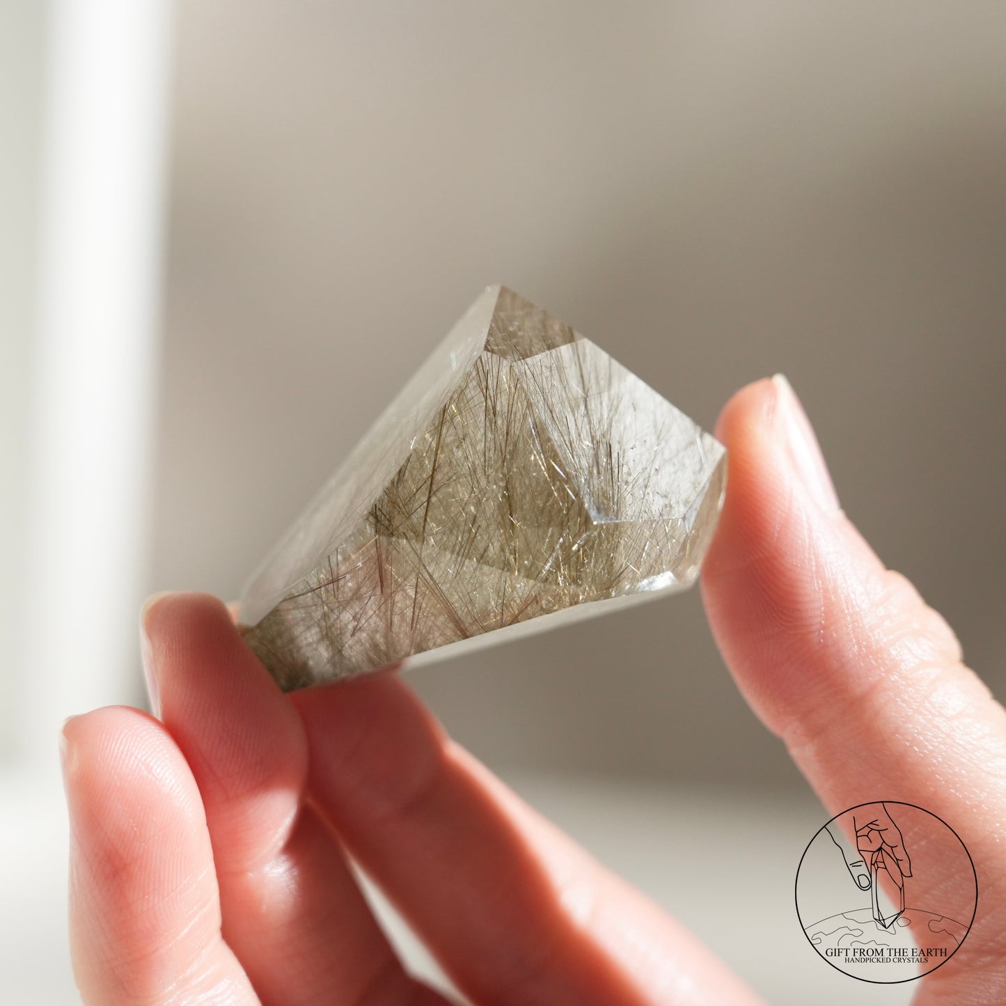 Green rutilated quartz sphere