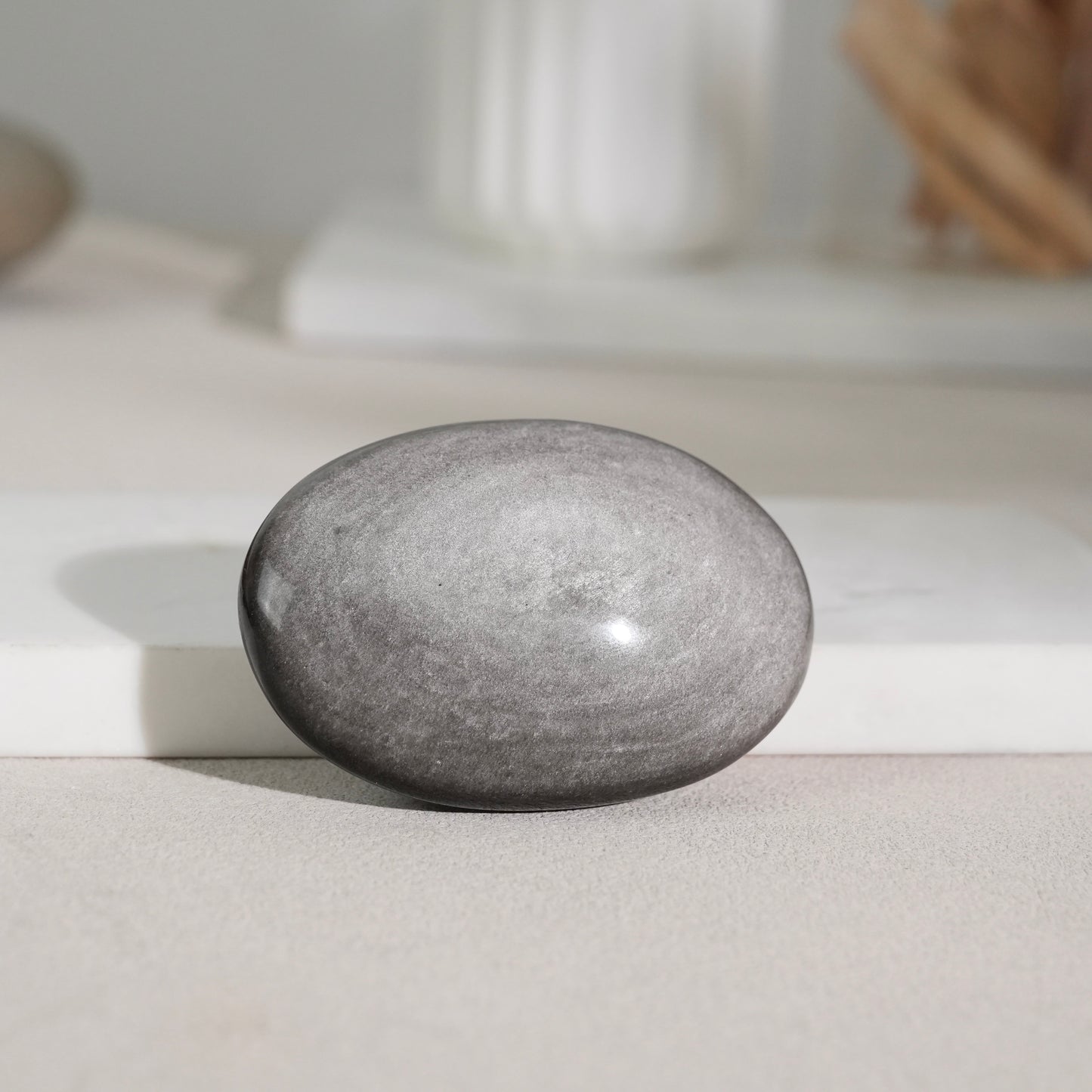 Silver sheen obsidian palm stone