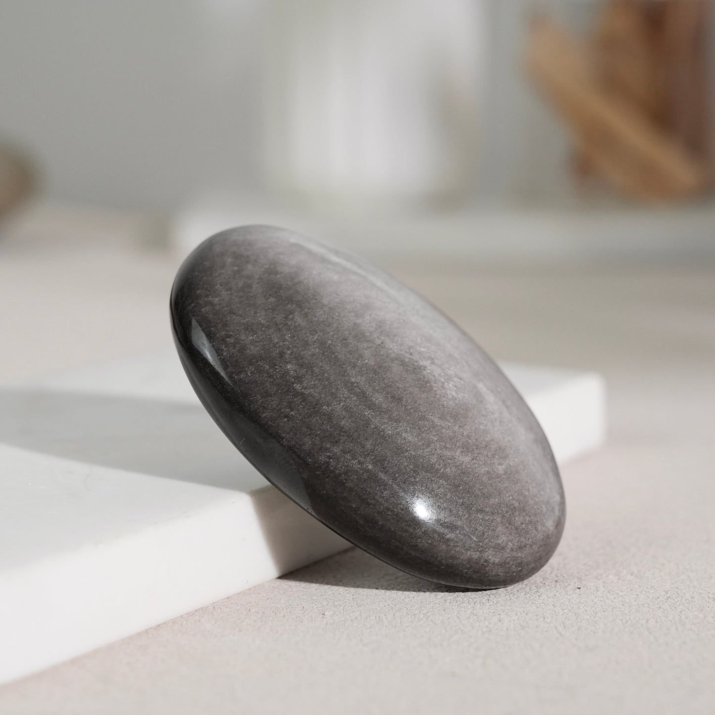 Silver sheen obsidian palm stone