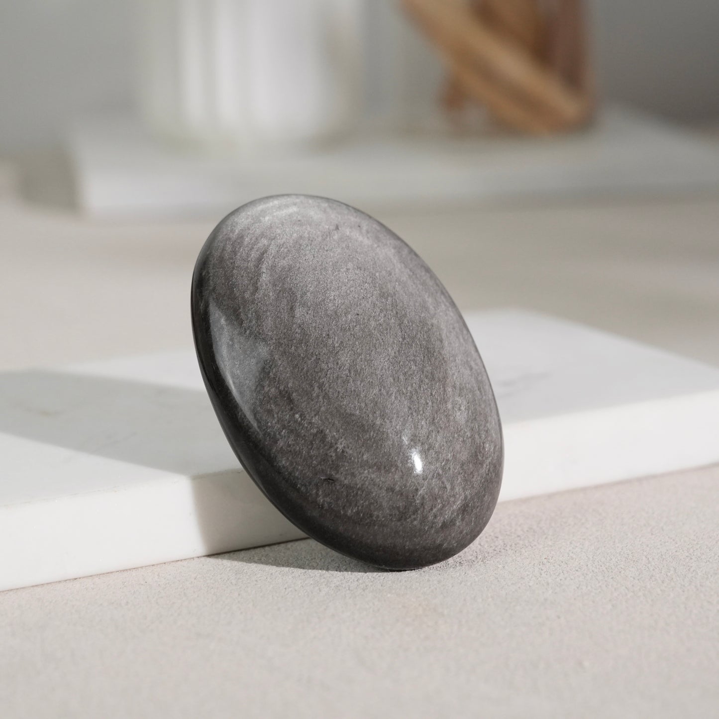 Silver sheen obsidian palm stone
