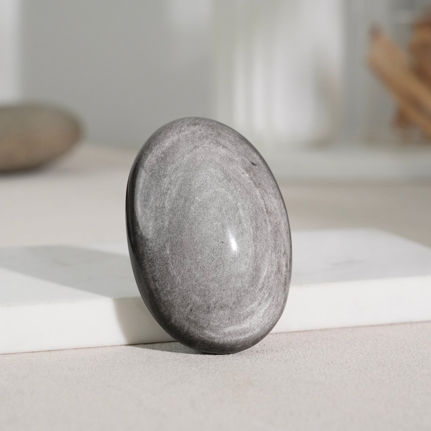 Silver sheen obsidian palm stone