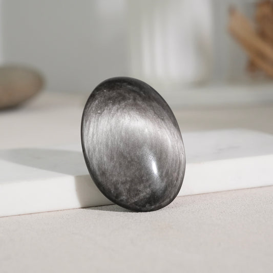 Silver sheen obsidian palm stone