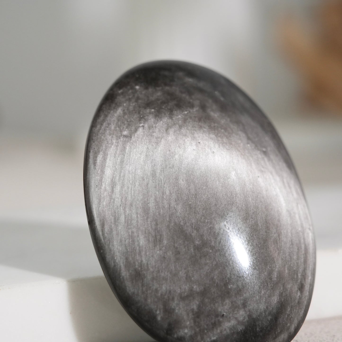 Silver sheen obsidian palm stone