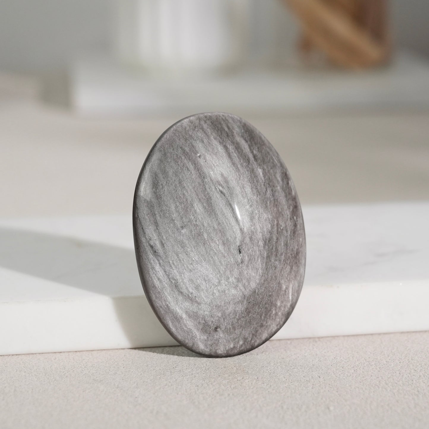 Silver sheen obsidian palm stone