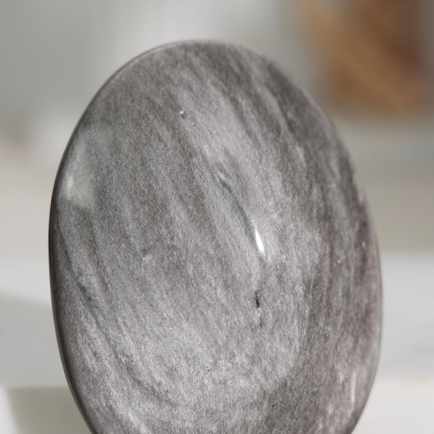 Silver sheen obsidian palm stone