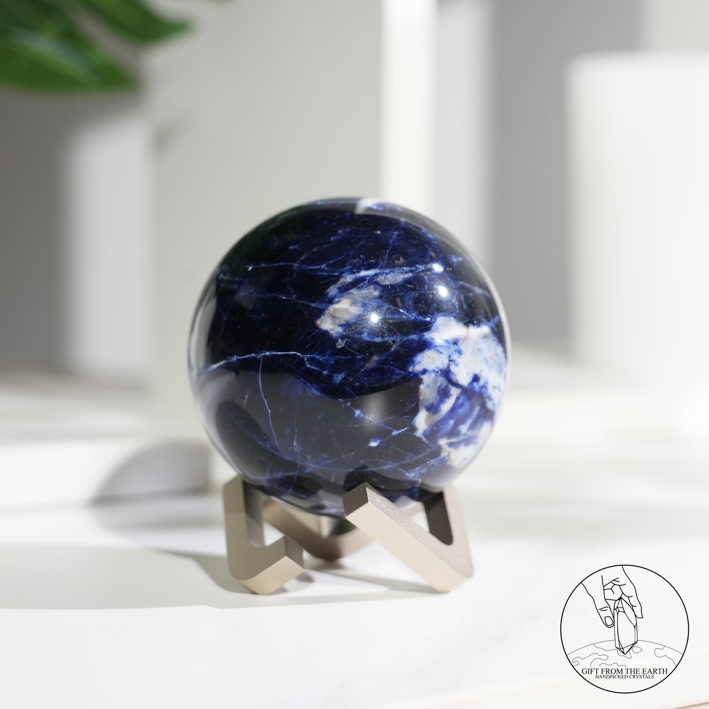 Larimar sphere with feldspar