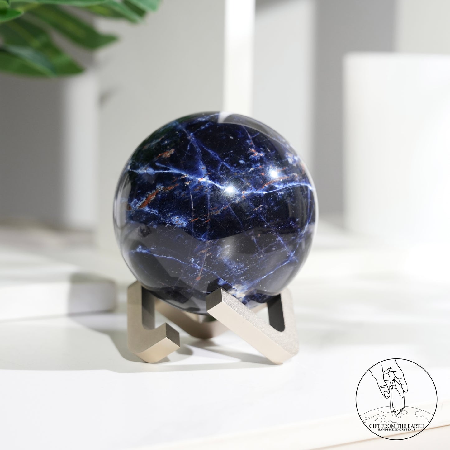 Larimar sphere with feldspar