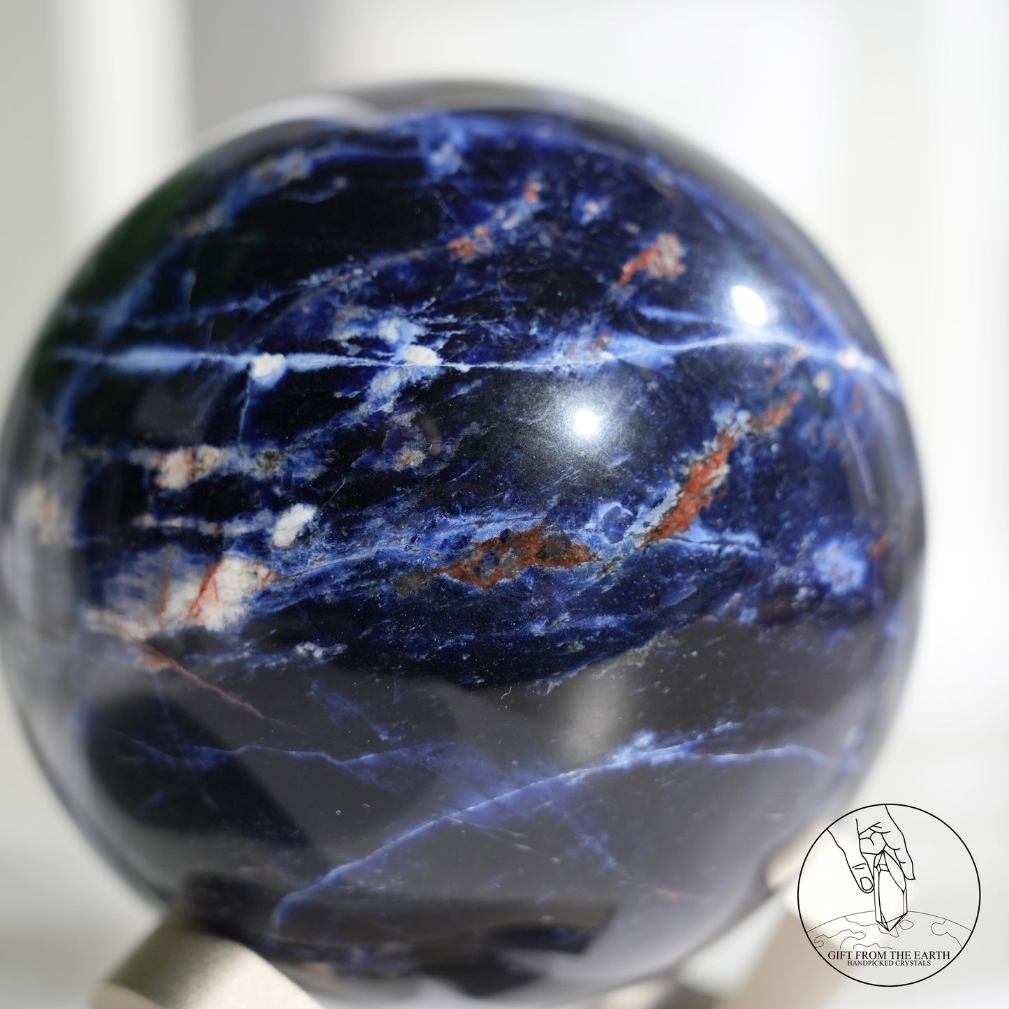 Larimar sphere with feldspar