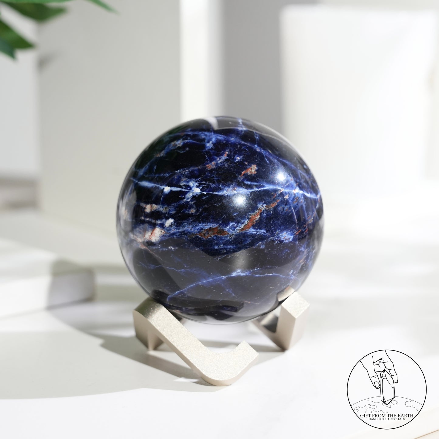 Larimar sphere with feldspar