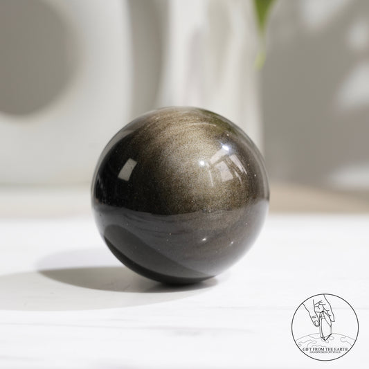 Golden obsidian sphere