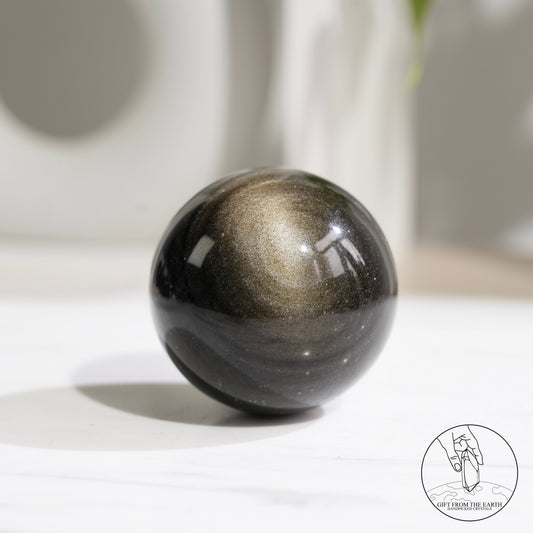 Golden obsidian sphere