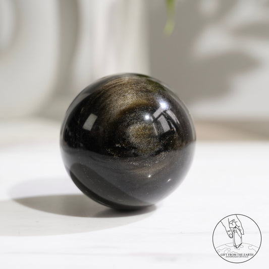 Golden obsidian sphere