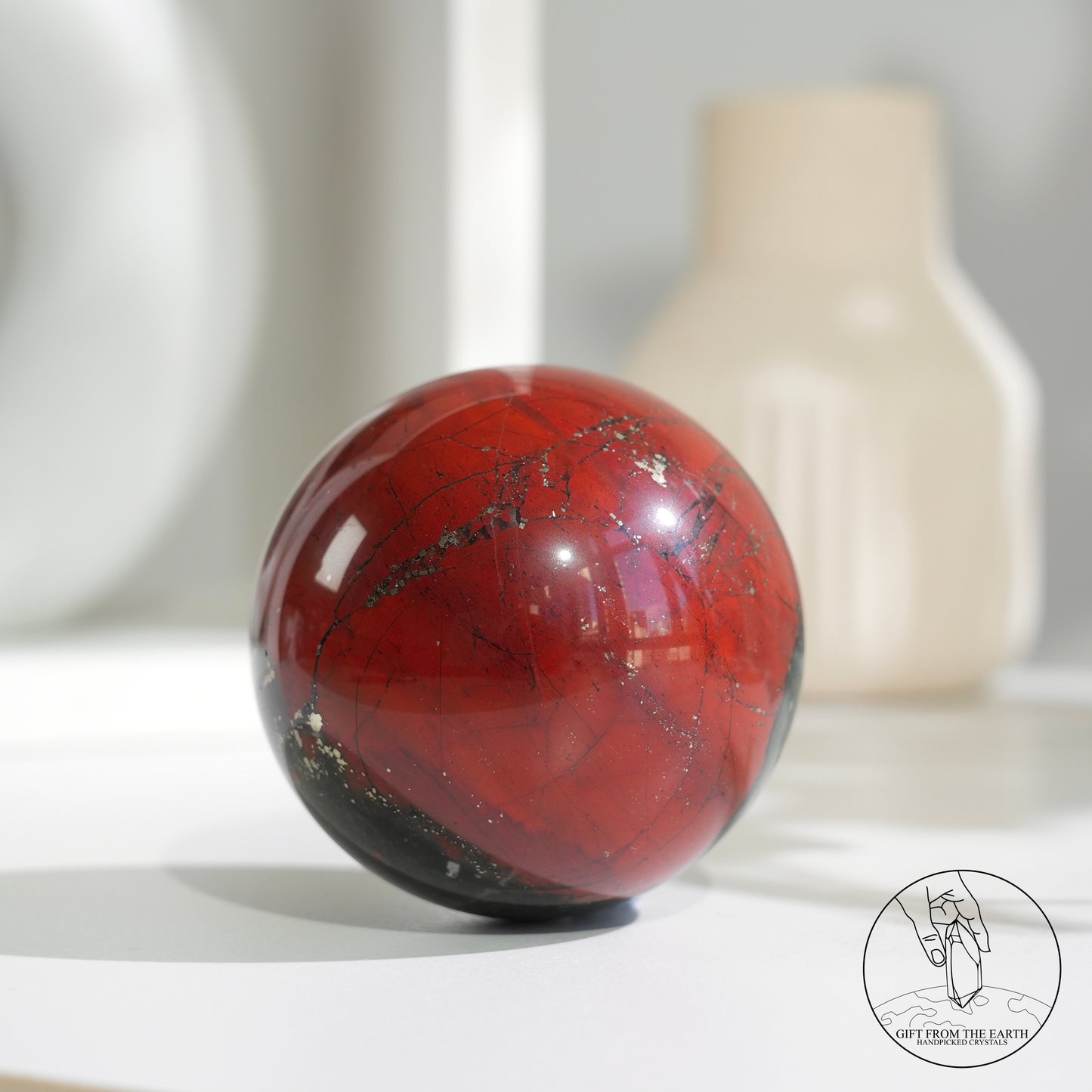 Bloodstone sphere with pyrite