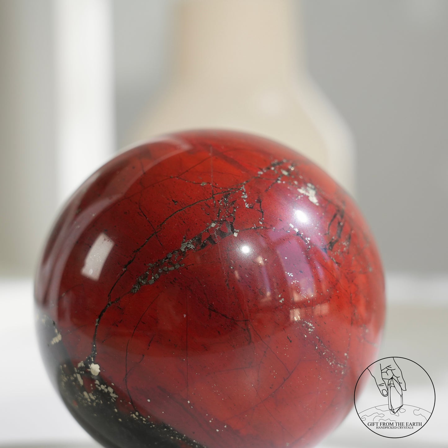 Bloodstone sphere with pyrite