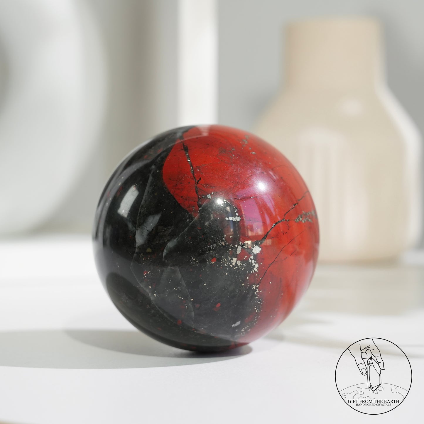 Bloodstone sphere with pyrite