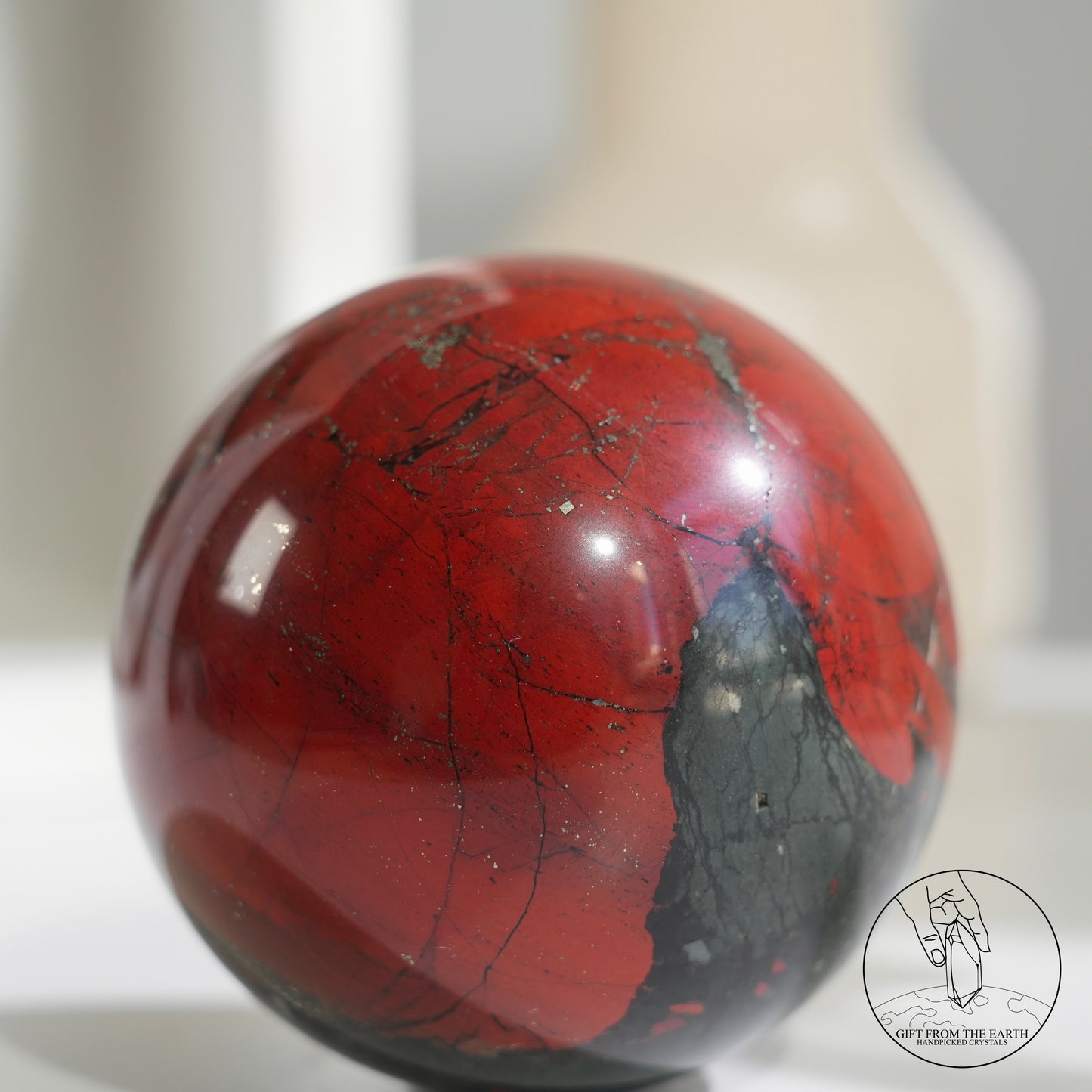 Bloodstone sphere with pyrite