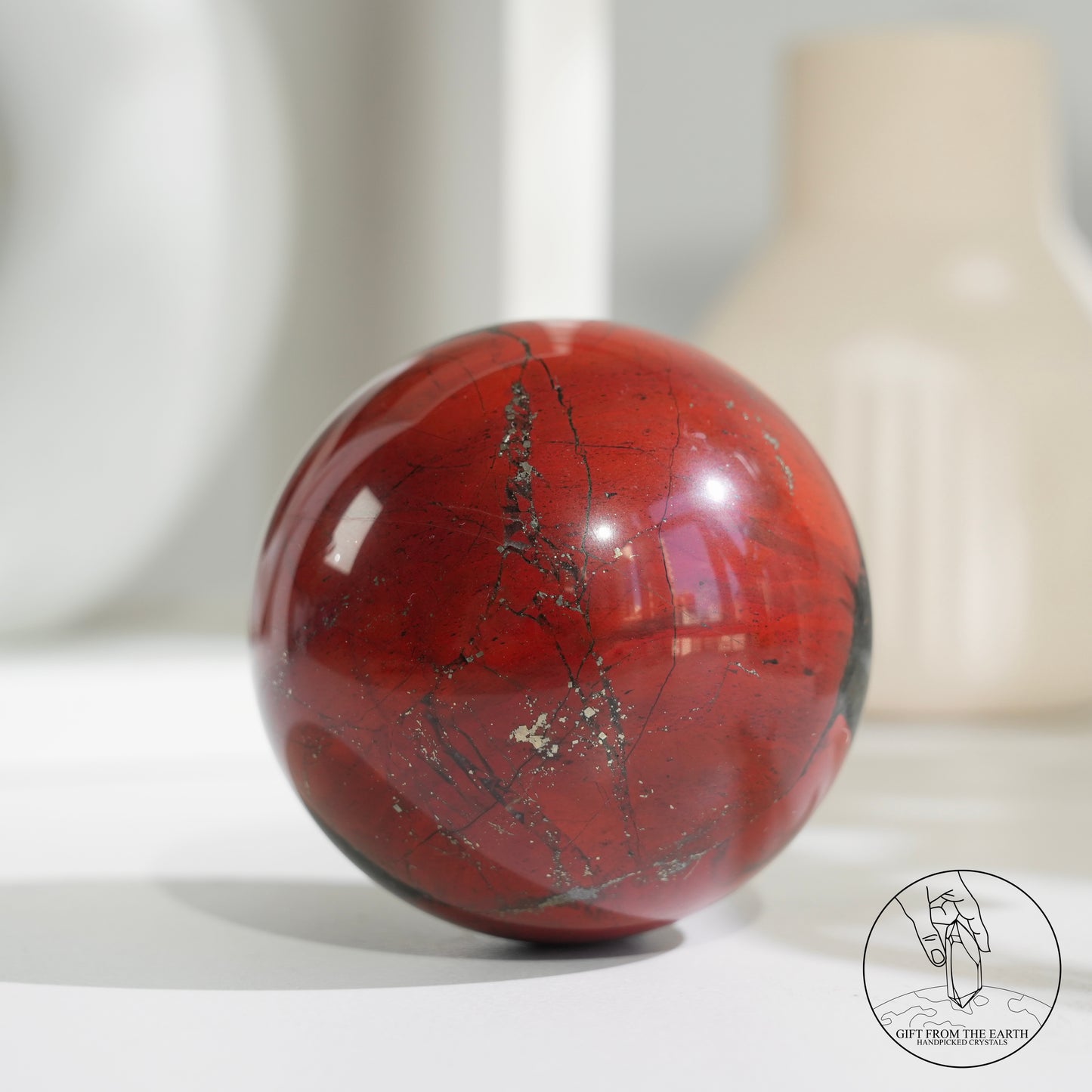 Bloodstone sphere with pyrite