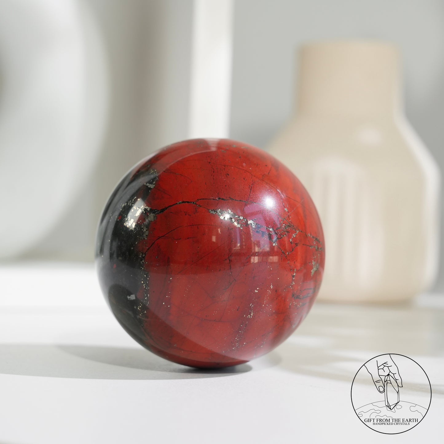 Bloodstone sphere with pyrite