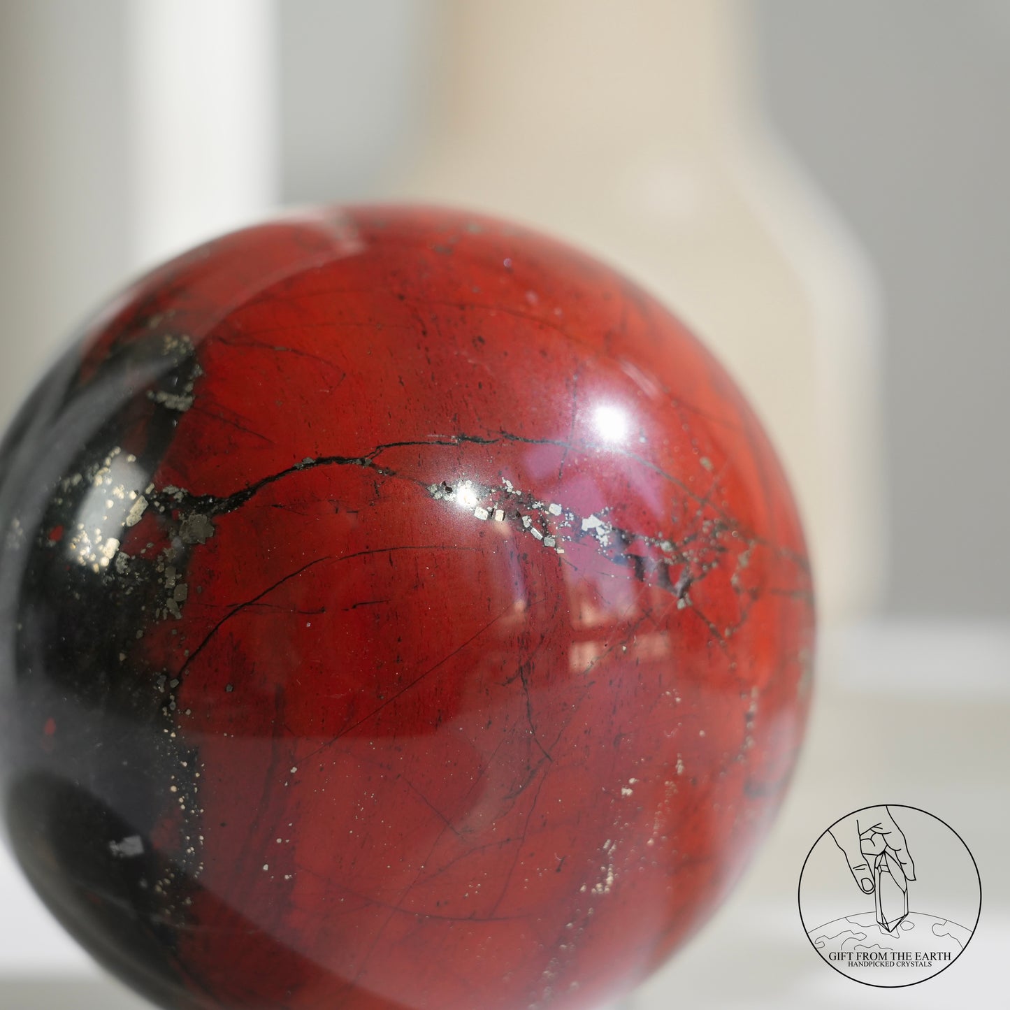 Bloodstone sphere with pyrite