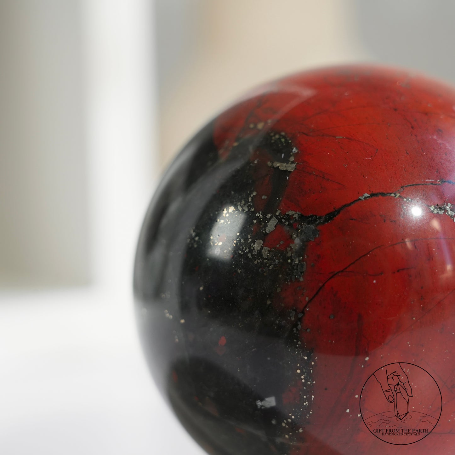 Bloodstone sphere with pyrite