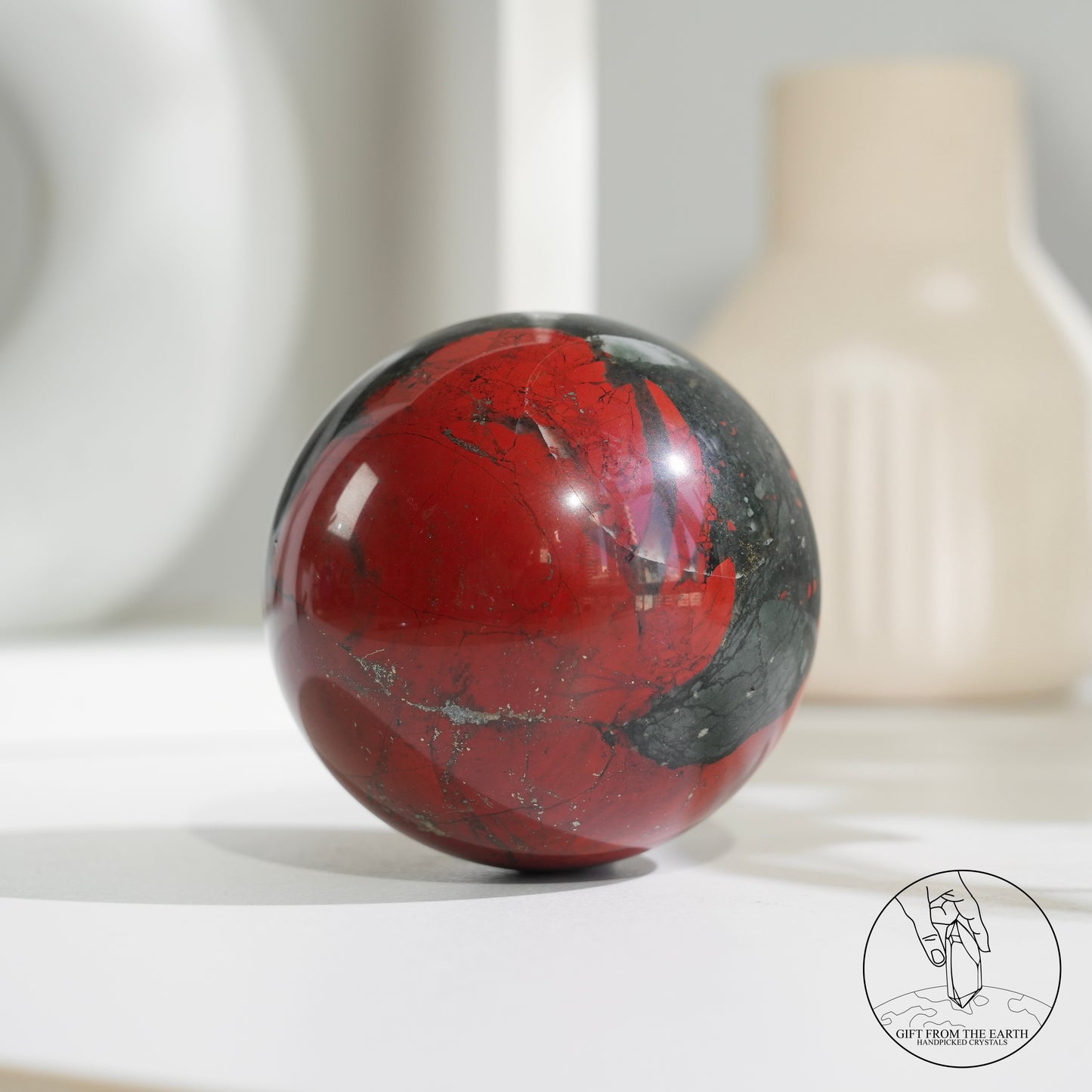 Bloodstone sphere with pyrite