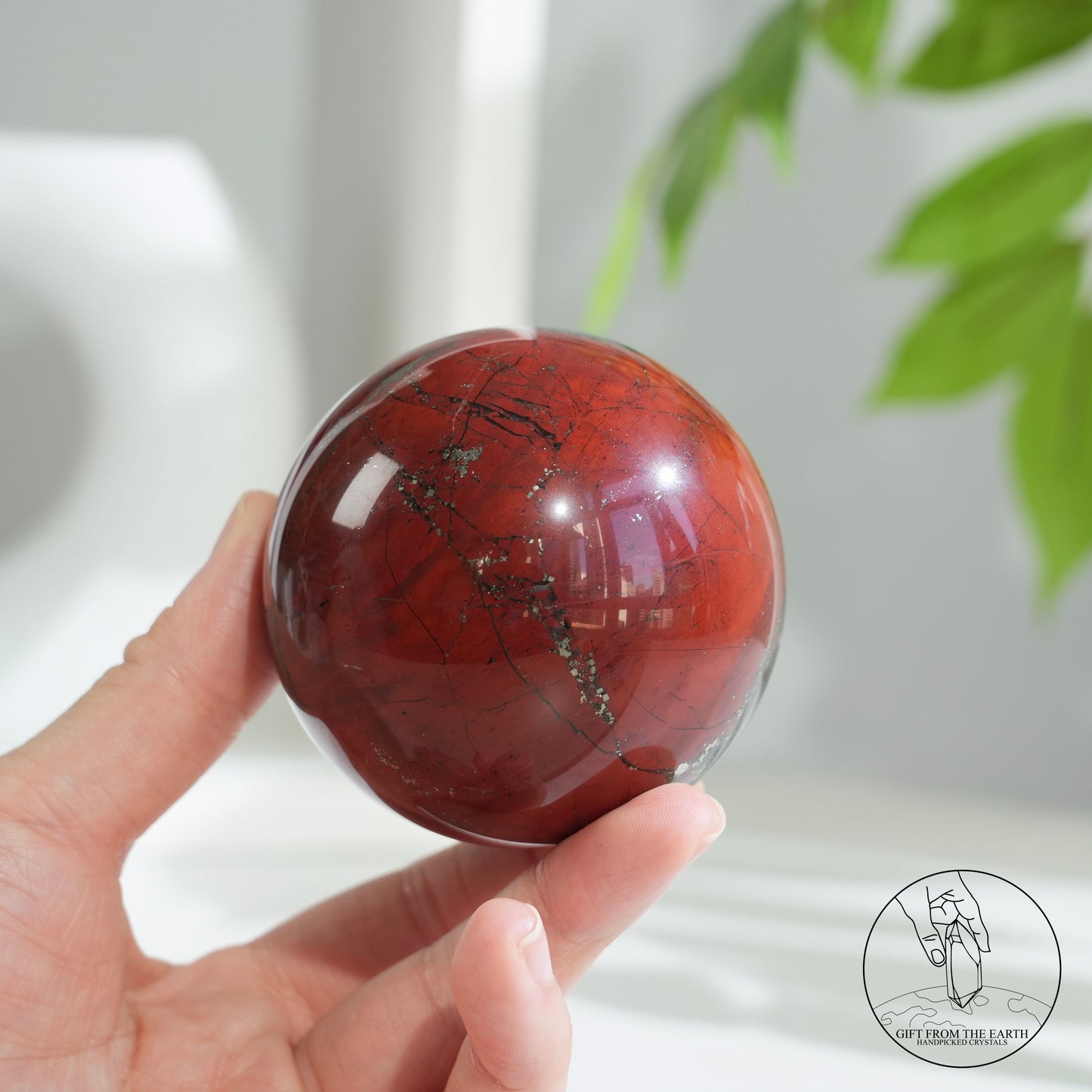 Bloodstone sphere with pyrite