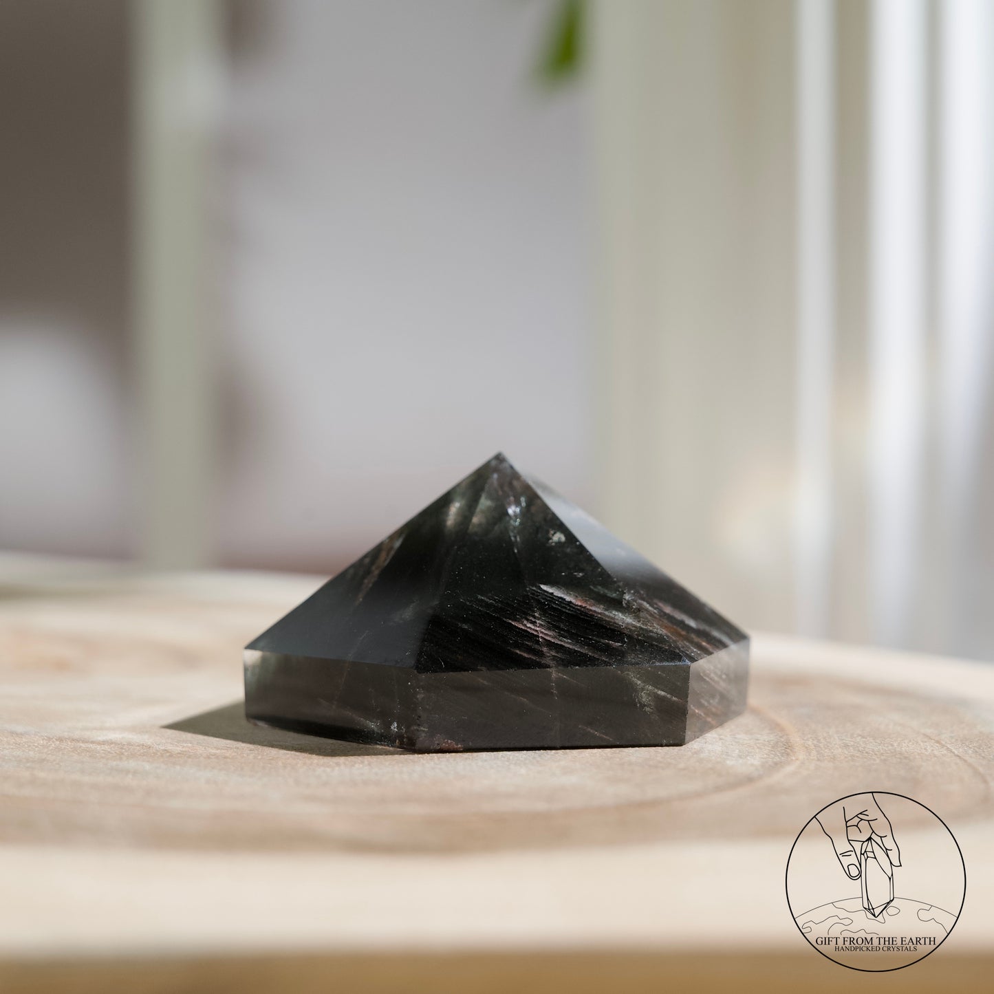 Half-polished multi-layered red-green phantom quartz point