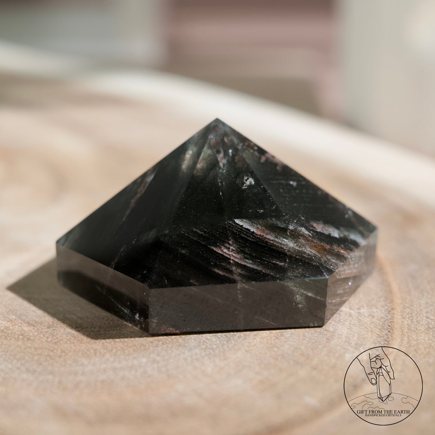 Half-polished multi-layered red-green phantom quartz point