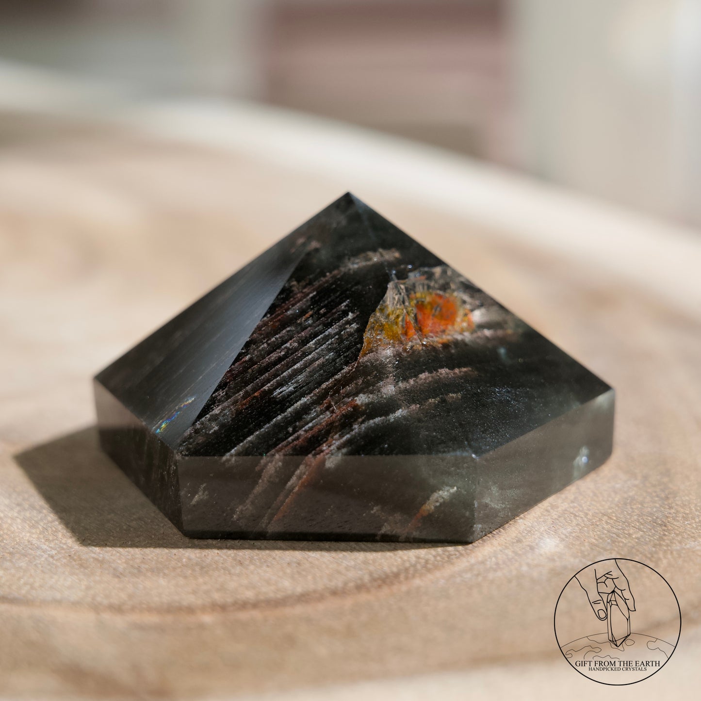 Half-polished multi-layered red-green phantom quartz point