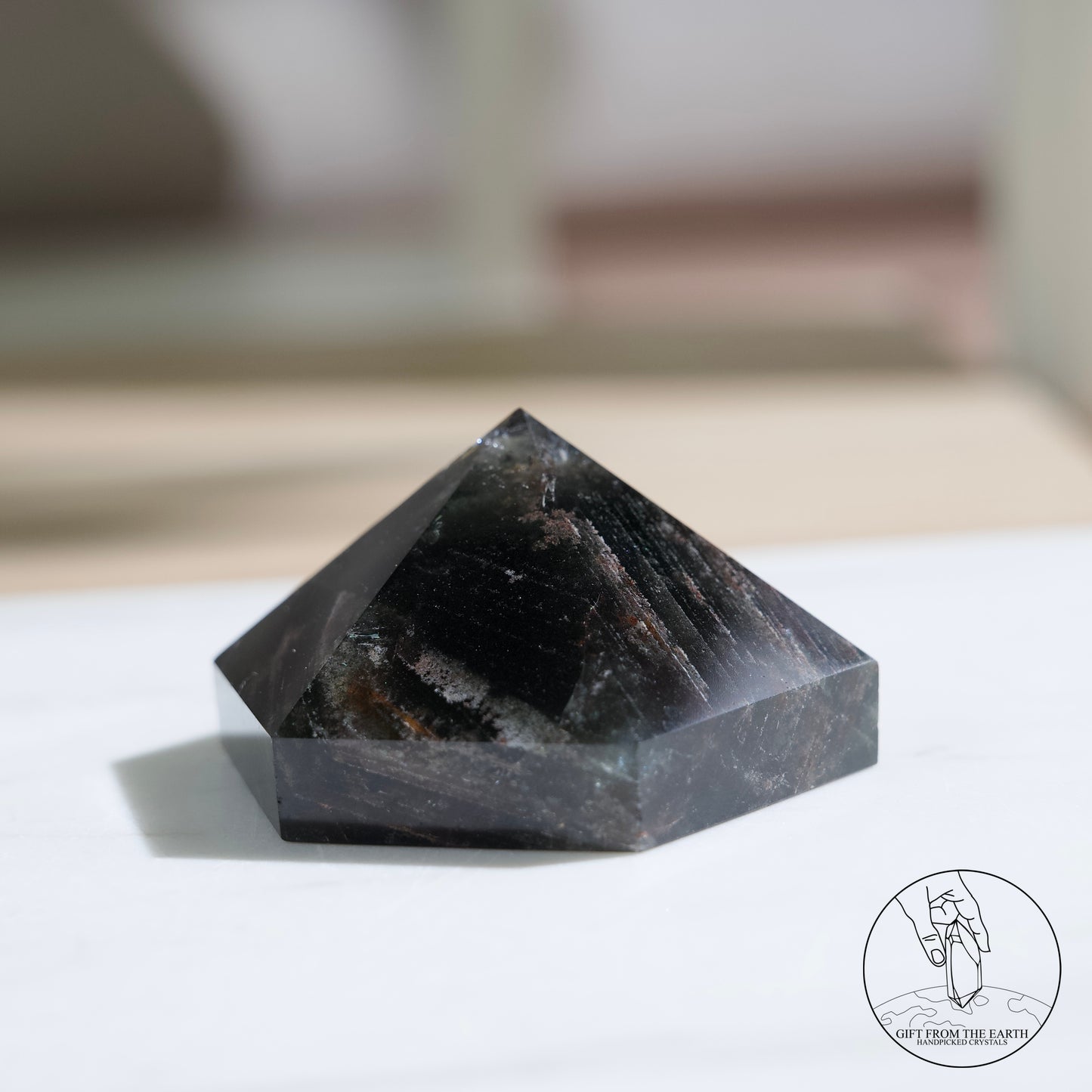 Half-polished multi-layered red-green phantom quartz point