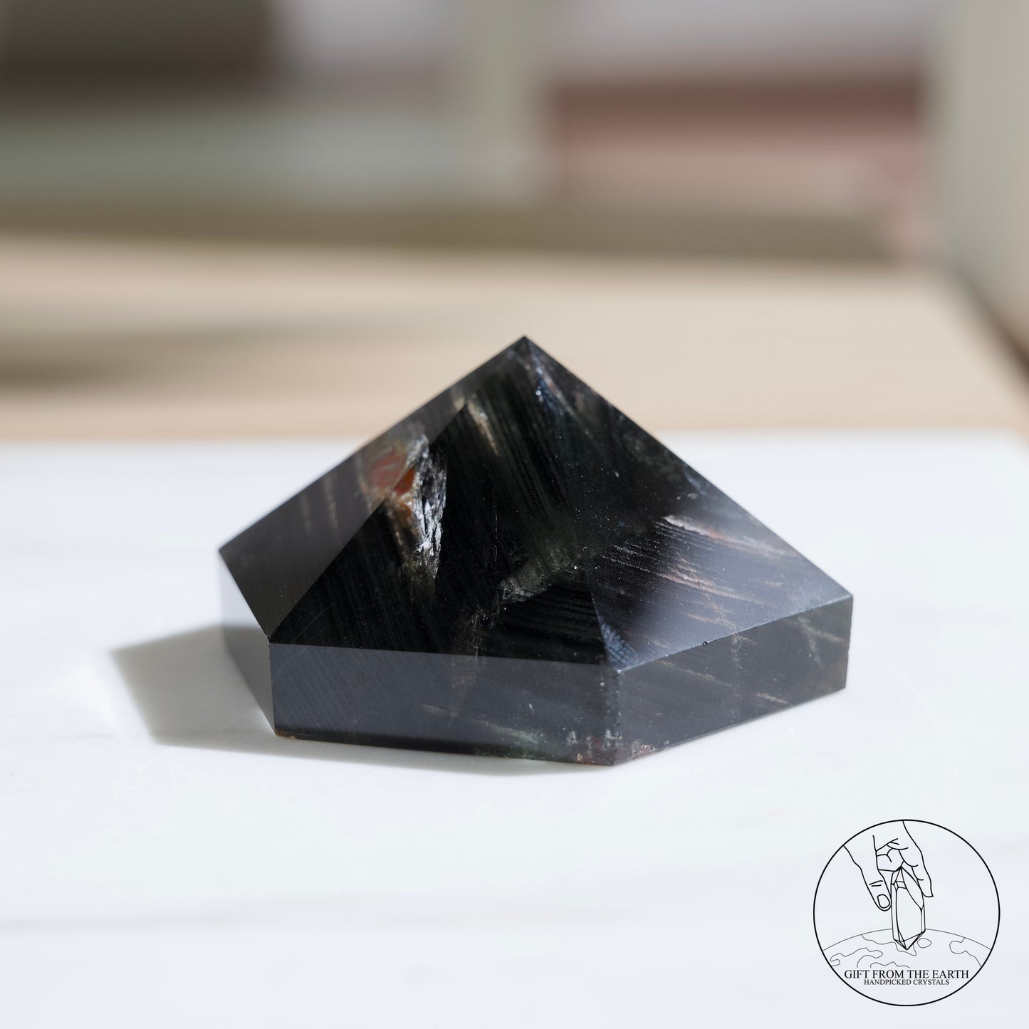 Half-polished multi-layered red-green phantom quartz point