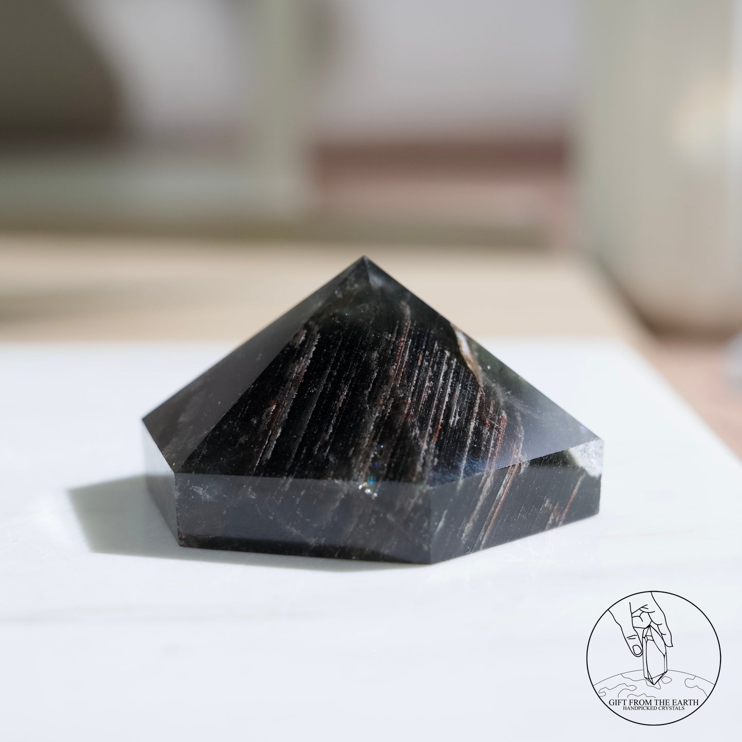 Half-polished multi-layered red-green phantom quartz point