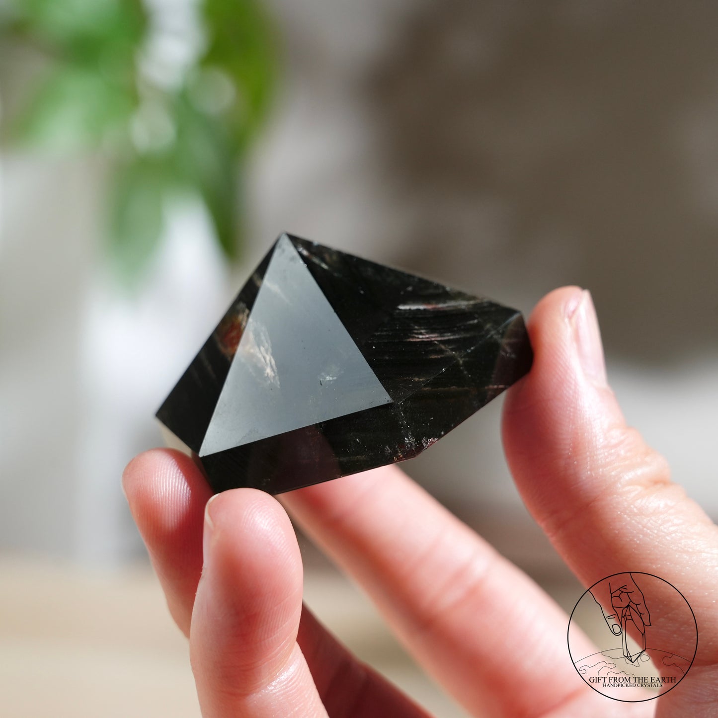 Half-polished multi-layered red-green phantom quartz point