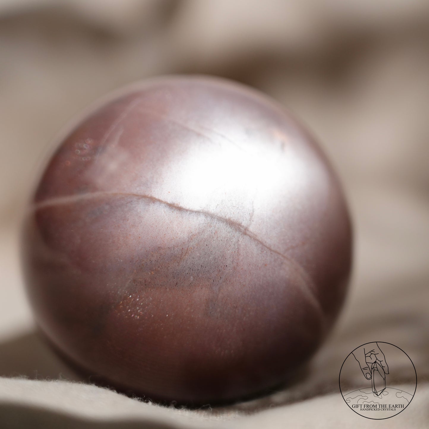 Orange moonstone sphere with sunstone