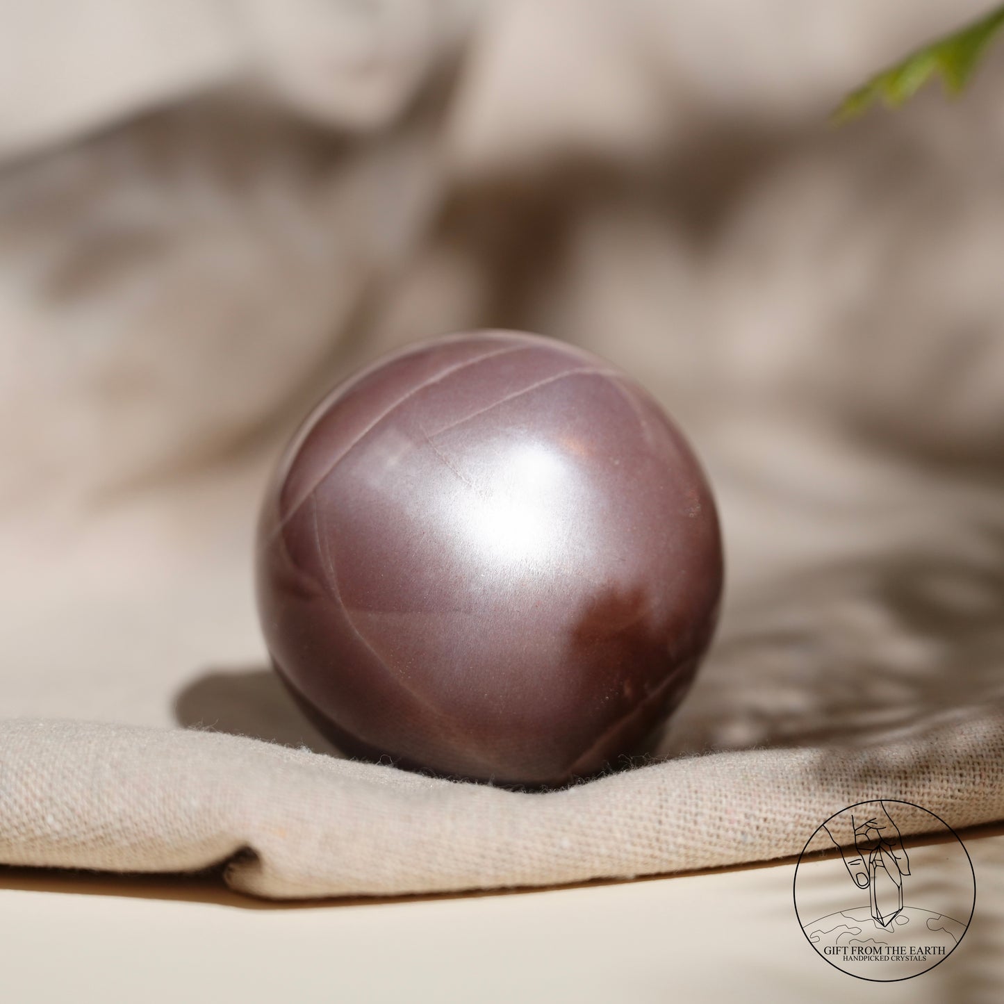 Orange moonstone sphere with sunstone