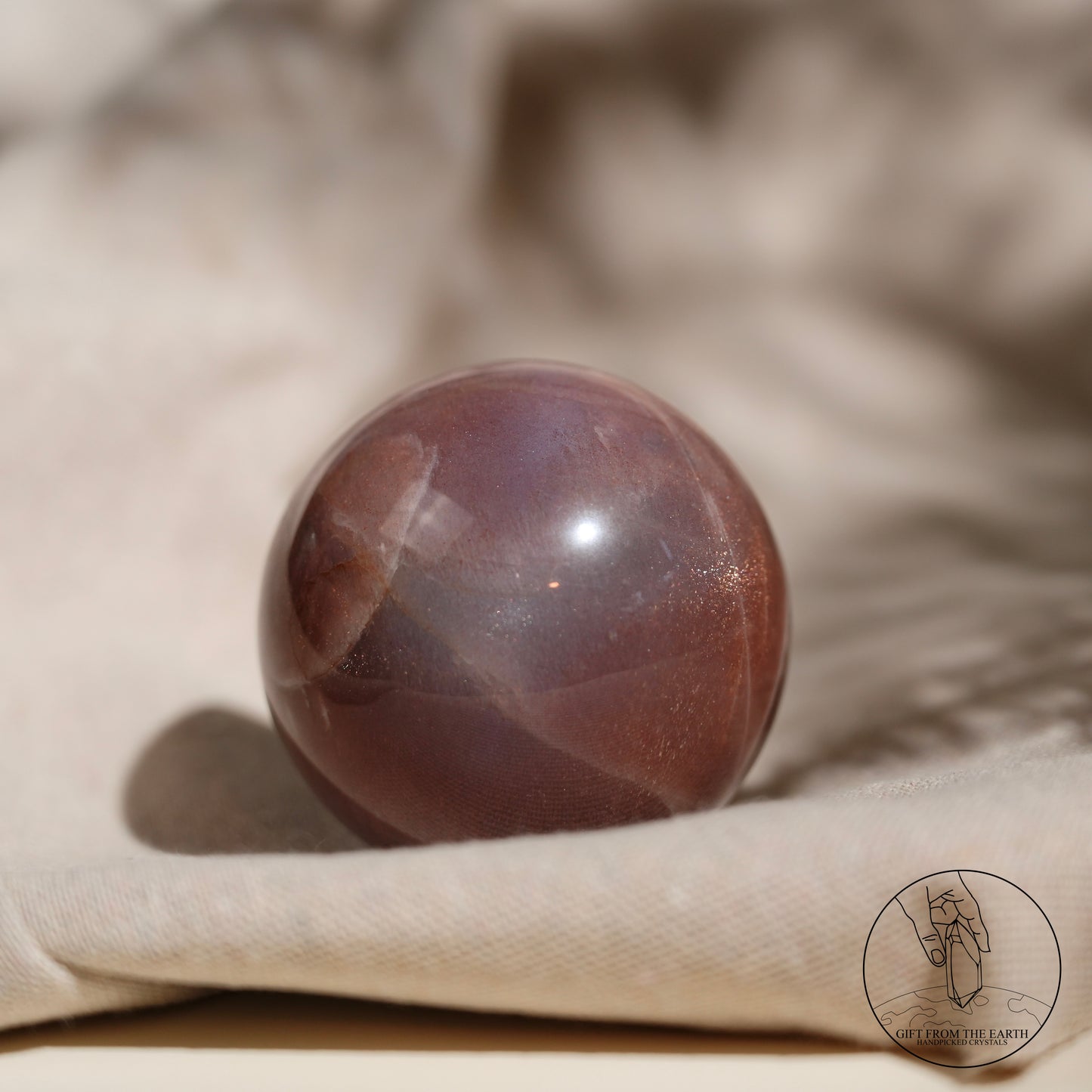 Orange moonstone sphere with sunstone