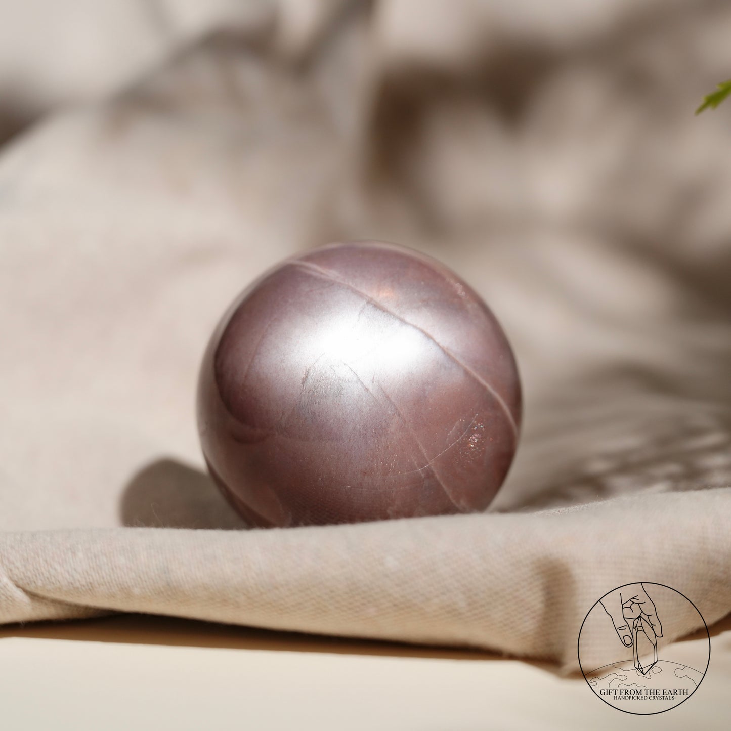 Orange moonstone sphere with sunstone