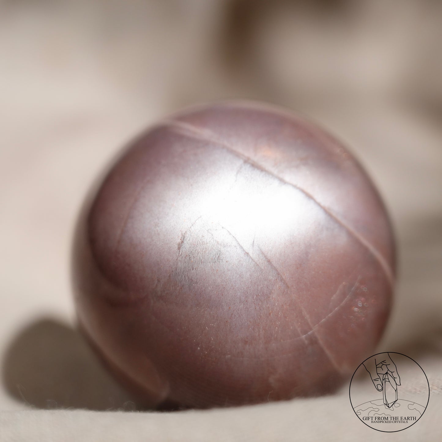 Orange moonstone sphere with sunstone