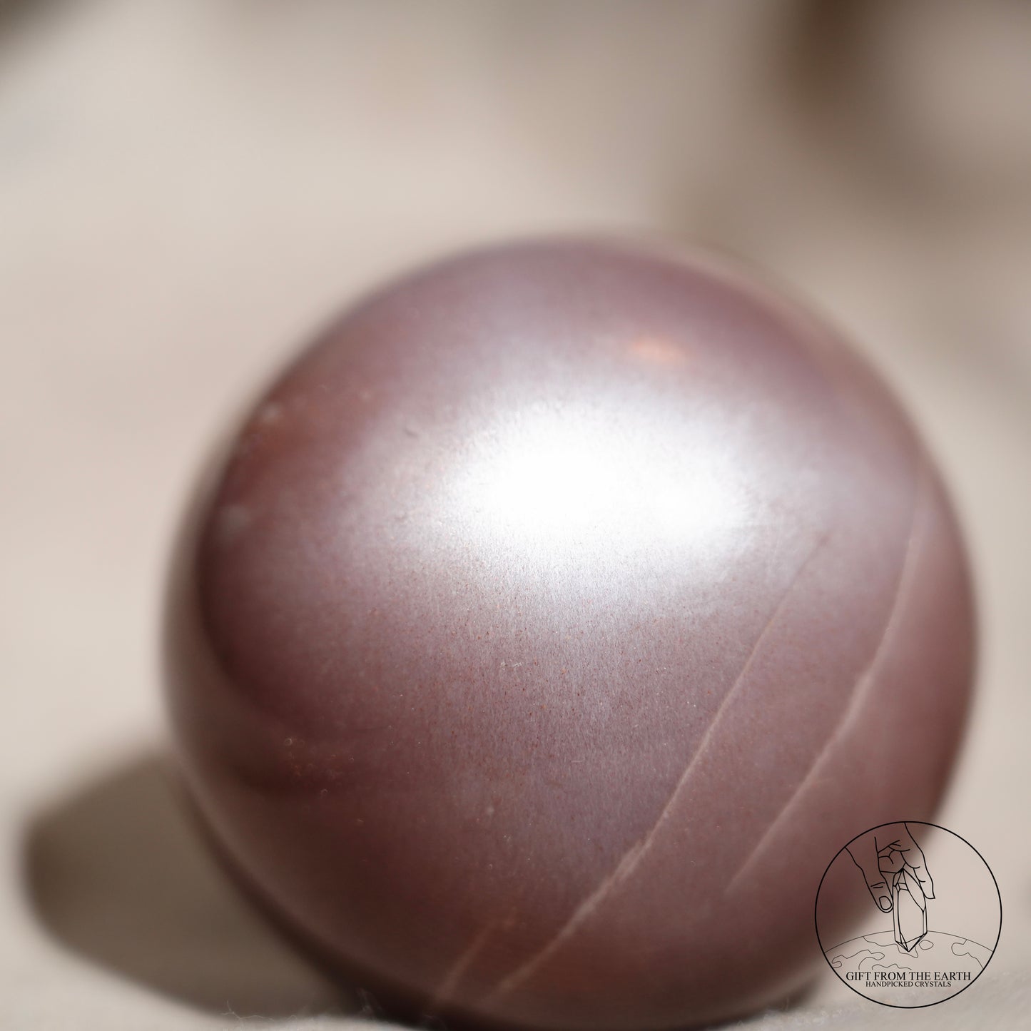 Orange moonstone sphere with sunstone