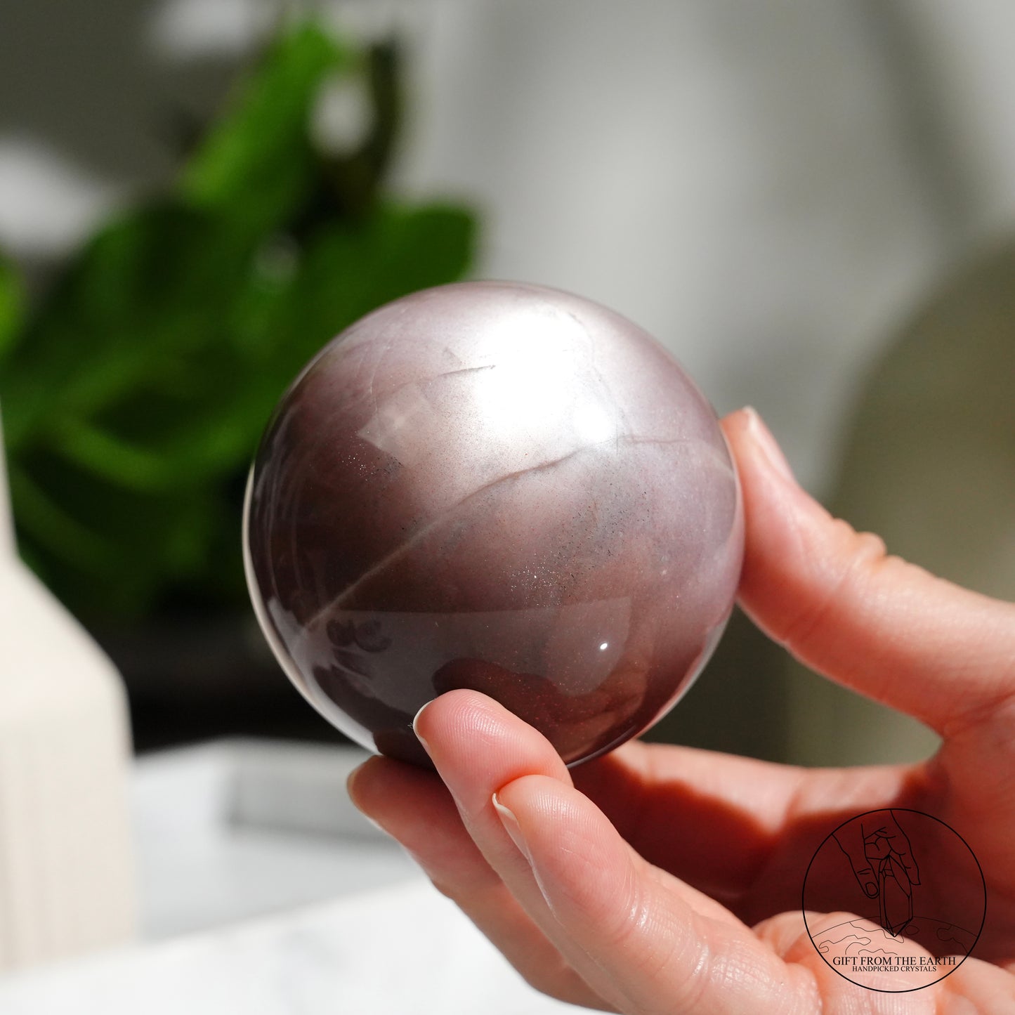 Orange moonstone sphere with sunstone