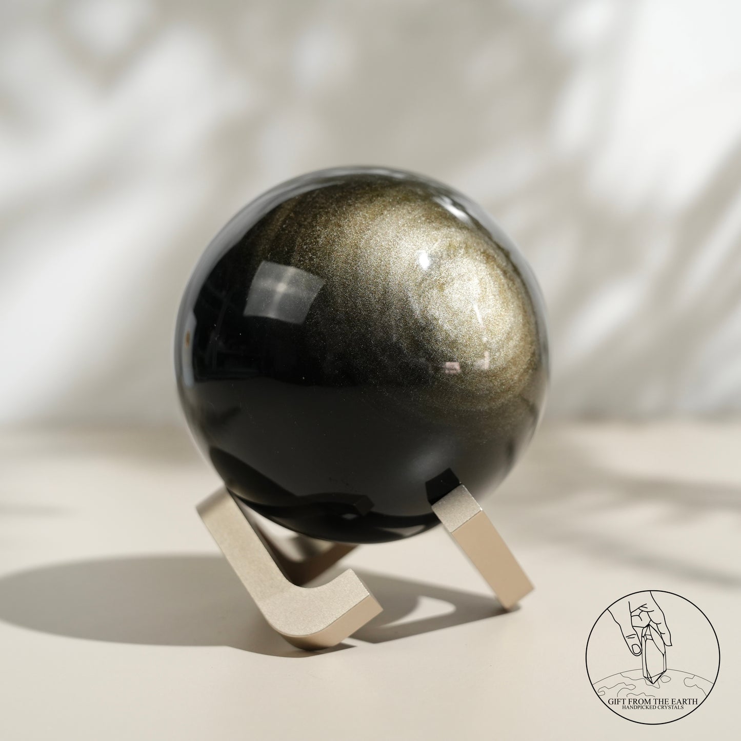 Golden obsidian sphere