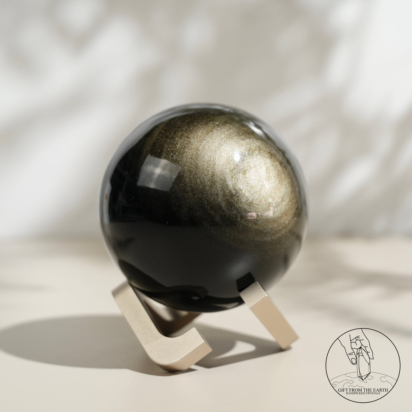 Golden obsidian sphere