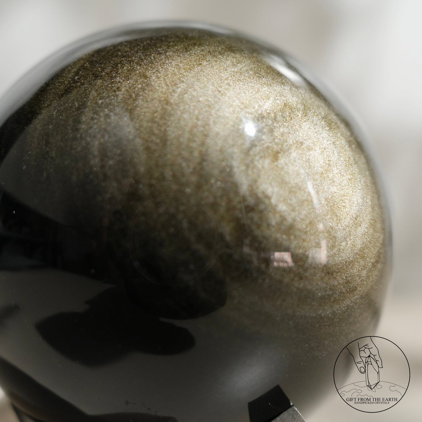 Golden obsidian sphere