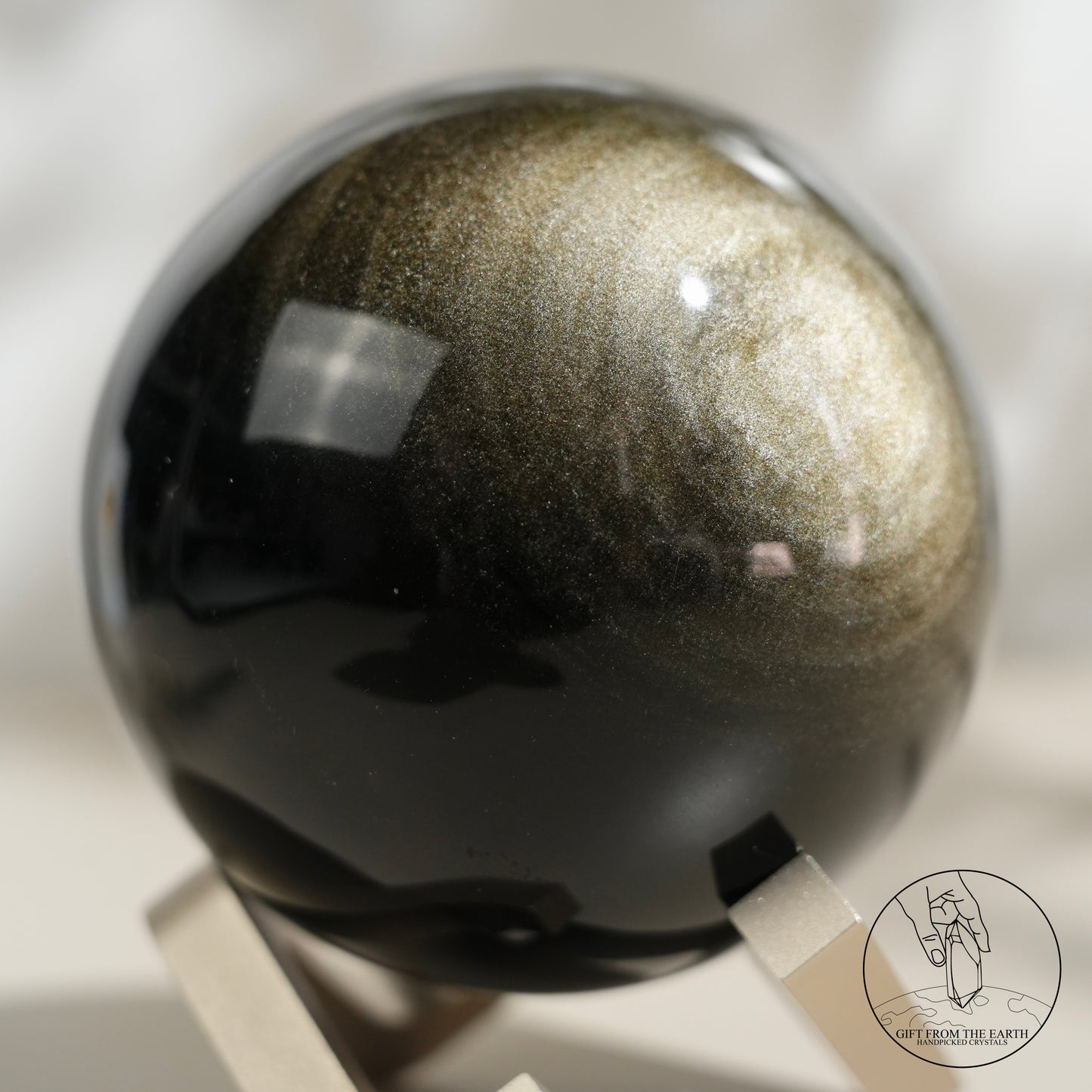 Golden obsidian sphere