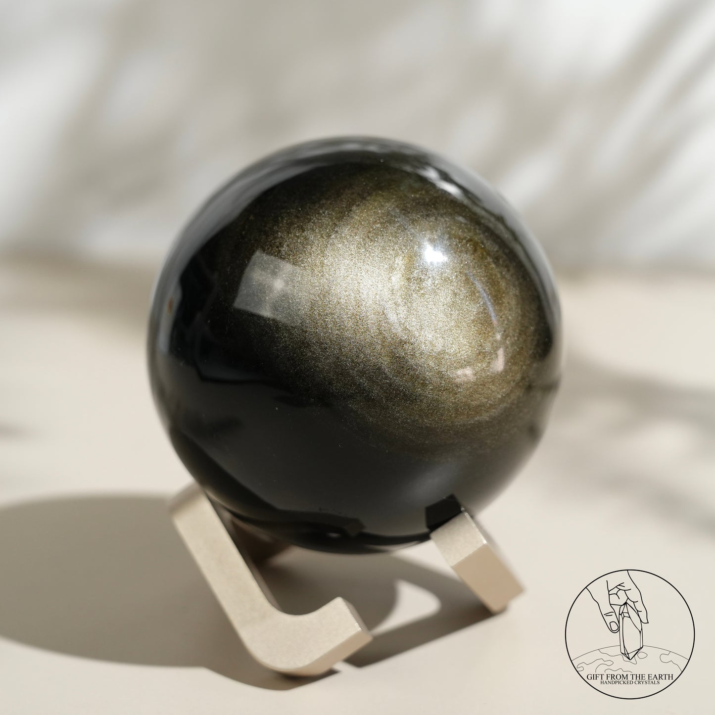 Golden obsidian sphere