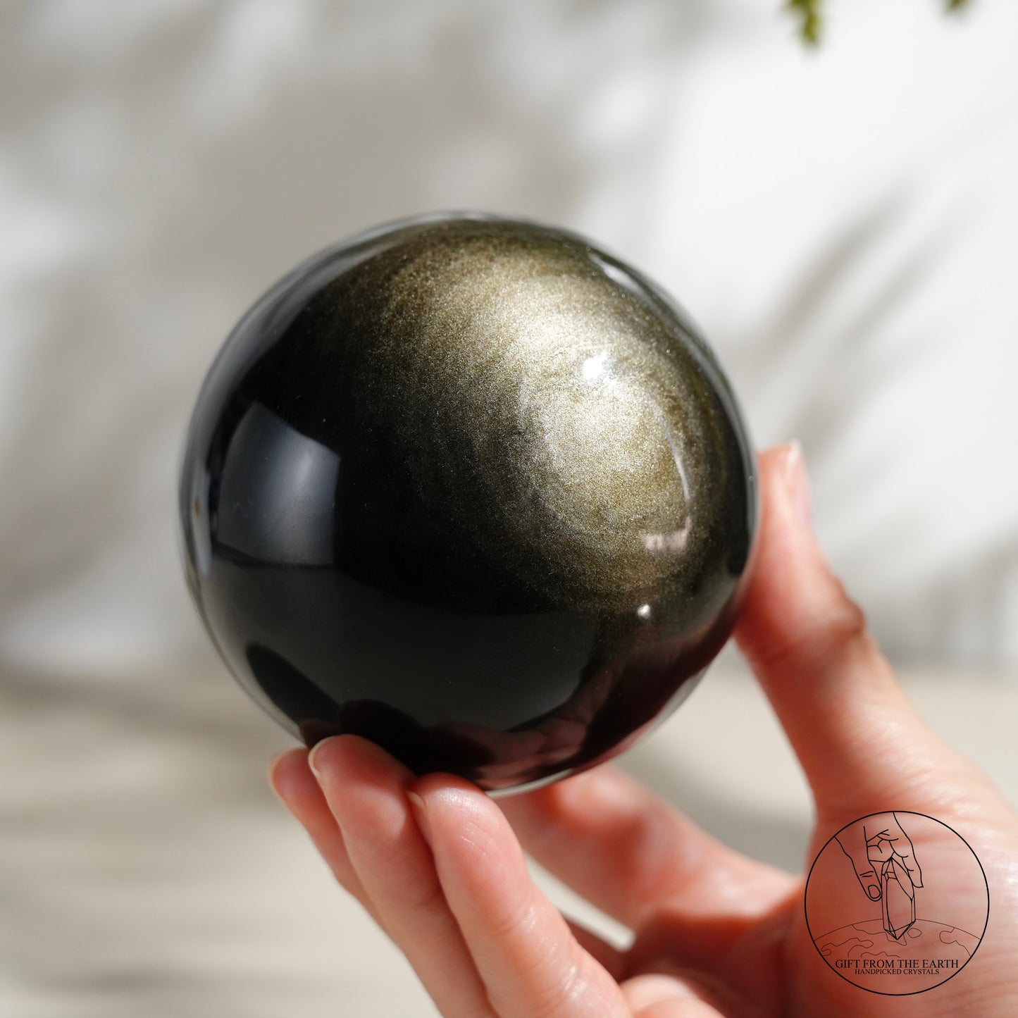 Golden obsidian sphere