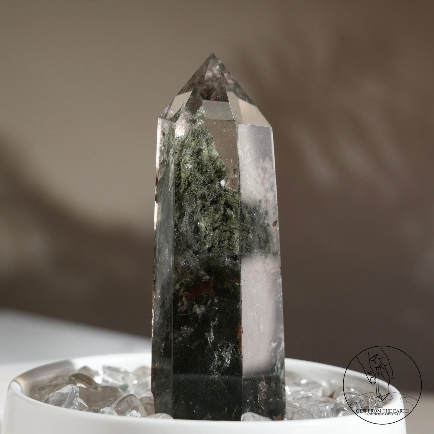 Half-polished multi-layered red-green phantom quartz point