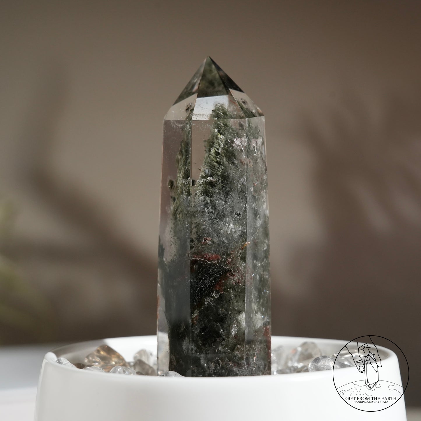 Half-polished multi-layered red-green phantom quartz point