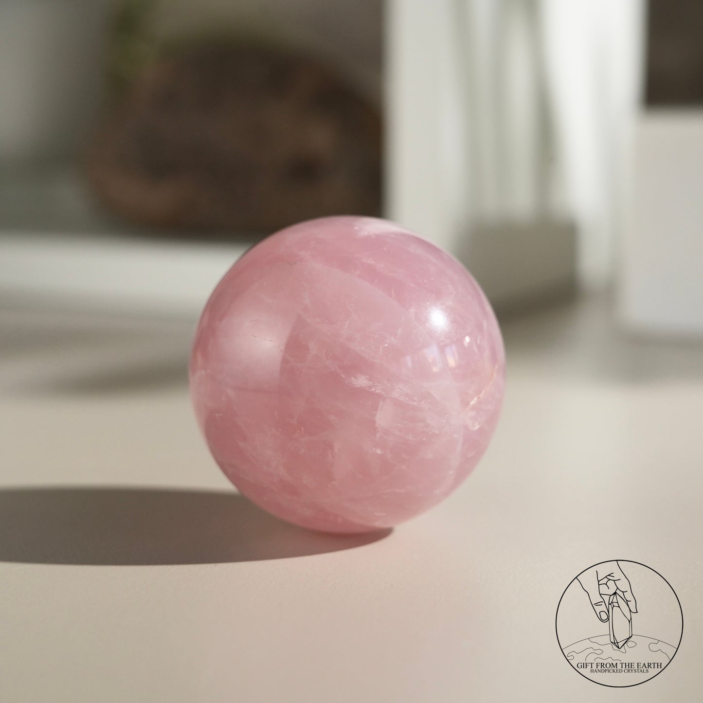 Mozambique starry rose quartz sphere