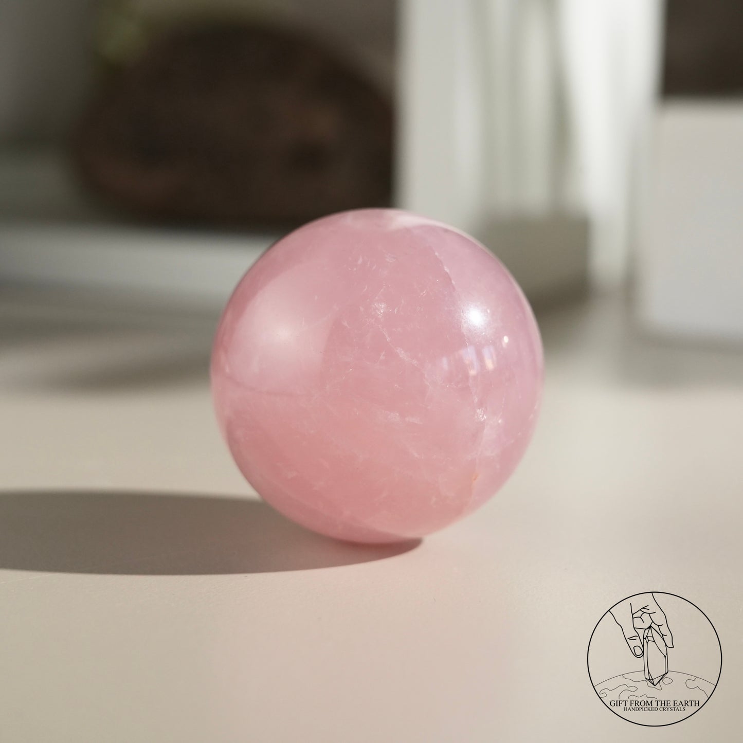 Mozambique starry rose quartz sphere